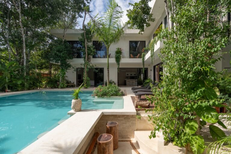 Casa Chen villa in Tulum with its private pool framed by tropical garden and jungle