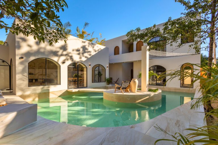 White terraces and private pool of Casa Alba villa surrounded by jungle in Tulum